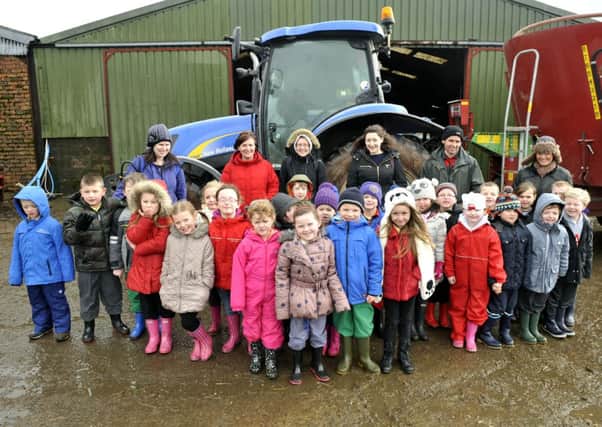 Pupils from Robert Owen Primary School getting tour of Hillhead dairy farm from farmer William Baillie
Thankerton
20/2/14