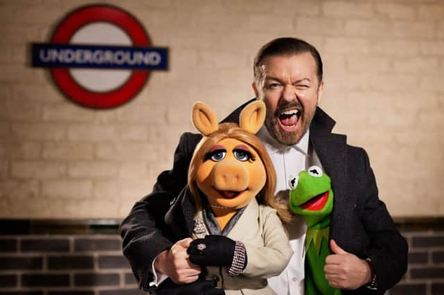 Ricky Gervais (as Dominic Badguy) with Kermit (or is it?) and Miss Piggy.