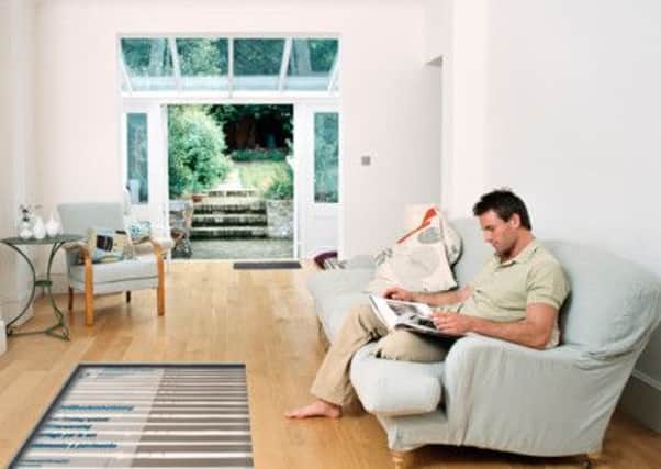 Relax in a room with an underfloor heating system. Photo: PA Photo/www.AskForUnderfloor.org.uk