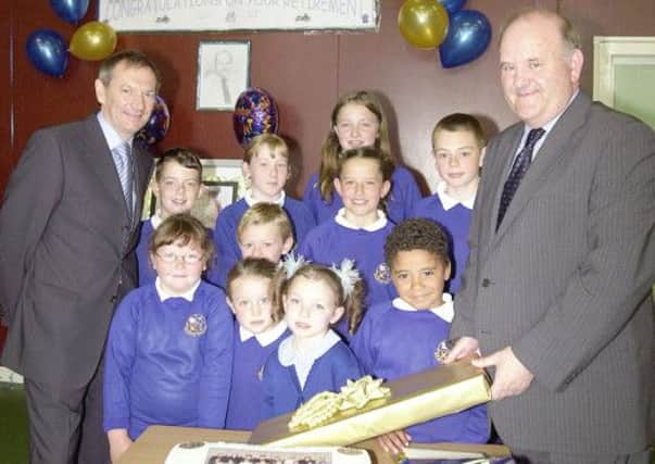 GOODBYE SIR: Youngsters of Kilsyth Primary School say farewell to their headteacher Mr Gordon McDonald (right) who retired in 2004.