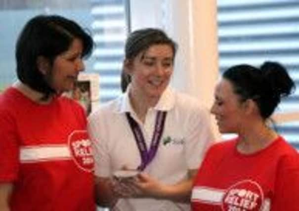 Libby chats to Sport Relief volunteers at SSE in Cumbernauld.