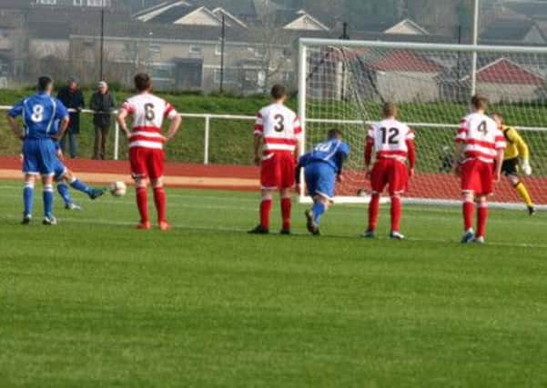 NUMBER THREE: Kilsyth Rangers' Francis Kelly (hidden by number eight) fires in from the penalty spot to make it 3-0 in 85 minutes.