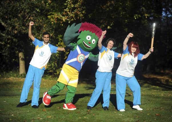 Clyde fun...Games mascot with volunteers