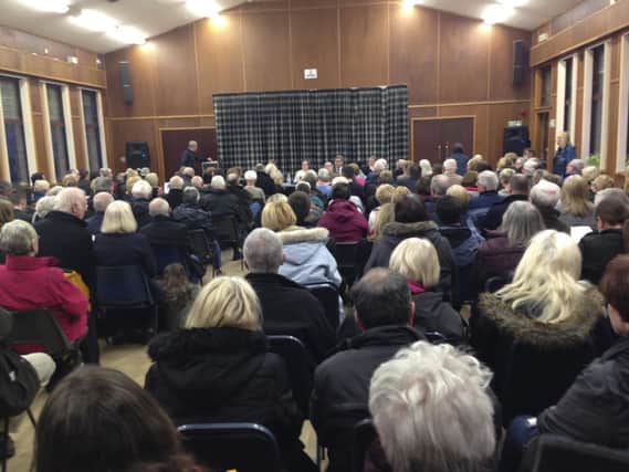 The meeting drew a packed crowd
