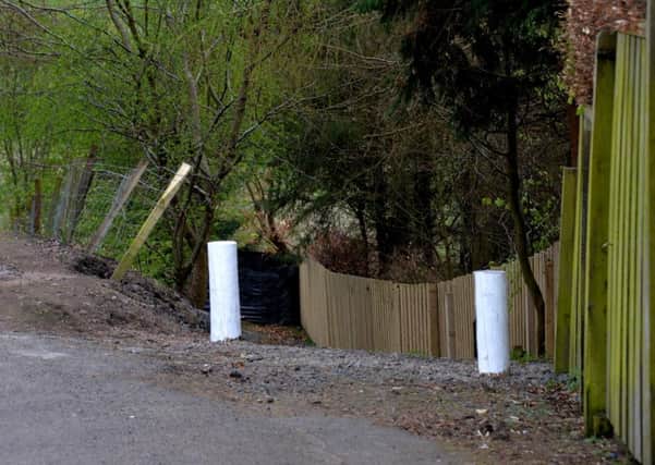 Bollards up...as council stakes its claim to the Delves Park path. (Pic by Rodger Price)