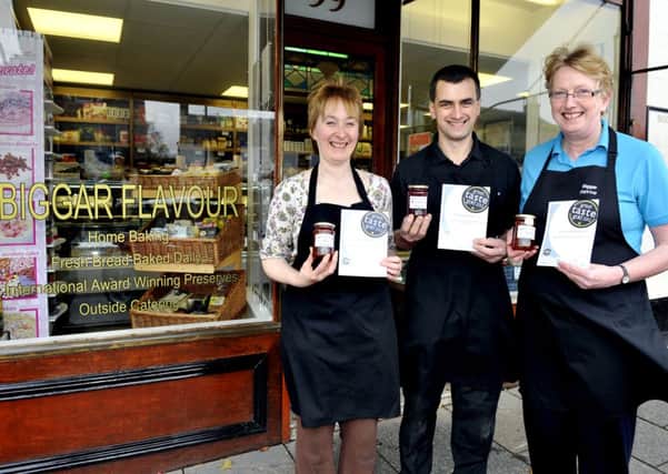 Jammy...Proprietors Jane and Ranald Brown along with Carolyn Cairns and their prize-winning jars of jam.