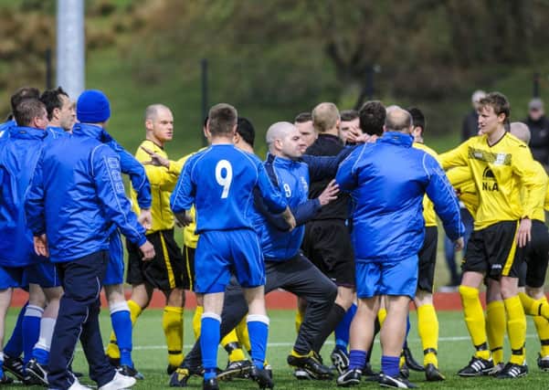 Fists of fury...Fighting broke out between the two teams after Carluke scored in the final minute of the match ( Pic by Andrew Wilson)