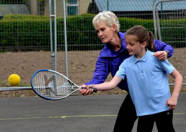 Swinging into action...Judy Murray shares her years of experience with a pupil at St John's (Pic Rodger Price)
