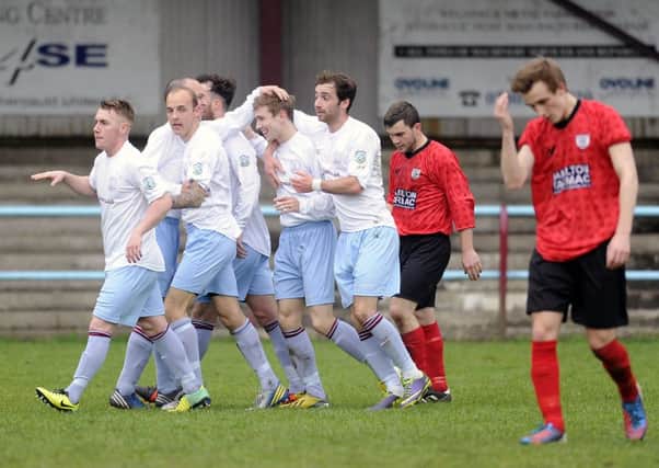 CONGRATULATIONS: Joe McCafferty is congratulated by his team-mates after opening the scoring for Cumbernauld United against Hurlford.