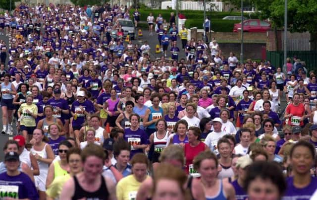 Runners make their way down Archerhill Road in Glasgow during the Womens 10k race in Glasgow on Sunday.
Pic Stephen Mansfield                     20/05/2001