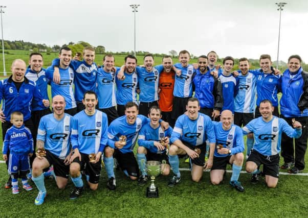 Up for the cup...the victorious Carluke Baps side with the Atholl Cup (Pic Andrew Wilson)