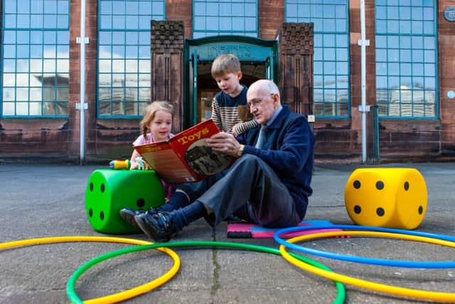 Milly Dickson and Calvin Masterton, both aged four years old from Oakwood House Nursery, Burnside and former Scotland Street school pupil, Stan Sewell, sharing some memories of the games of his childhood.