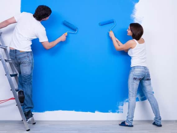 Painting a wall.
