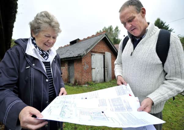 In the beginning...Trust chairman Sylvia Russell and education officer Chris Helm with the plans for the horticultural centre. (Pic Lindsay Addison)