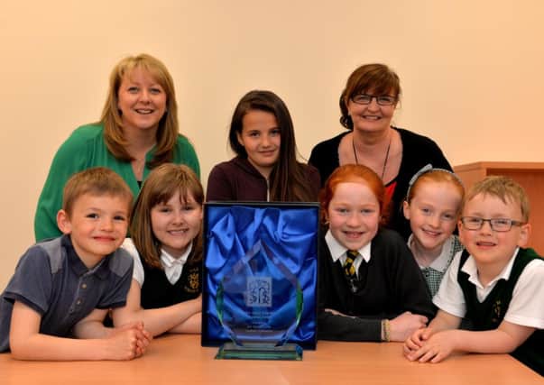 Always remembered...St Mary's pupils with the award in memory of Father Joe