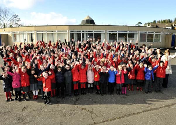 Mexican wave...as pupils wave goodbye to old Braidwood Primary