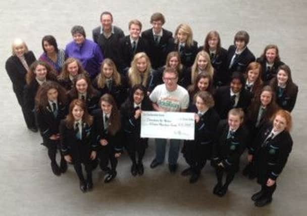 Jamie Aitken with some of the pupils who raised a stunning £15,000 for Malawi.