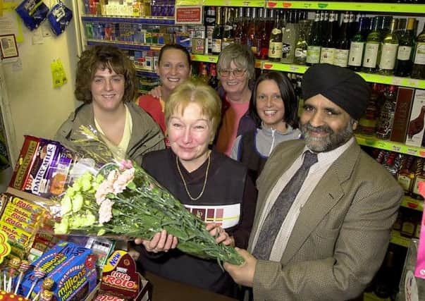 LEAVING ARCHWAYS: Shop assistant Elizabeth Tyrell retires in 2002 after 12 years serving in Archways shop in Main Street, Kilsyth. (Picture by Alan Murray, ref. 4111)