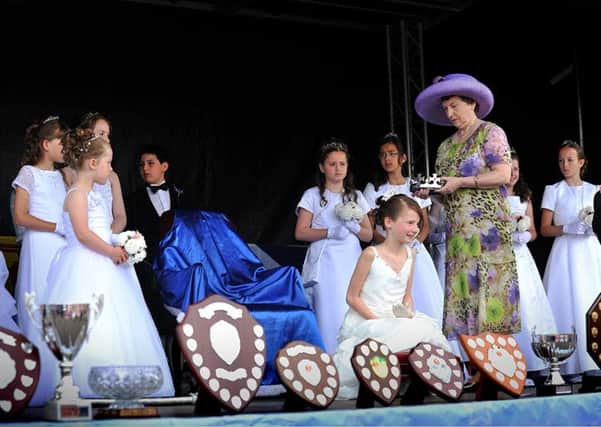 Crowning glory...Queen Claire-Jayne Rae was crowned by Linda Johnson at the 2014 Carluke Gala Day (Pics Roberto Cavieres)