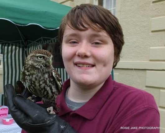 14 year old volunteer Jacqueline McLeod with Archimedes the owl.