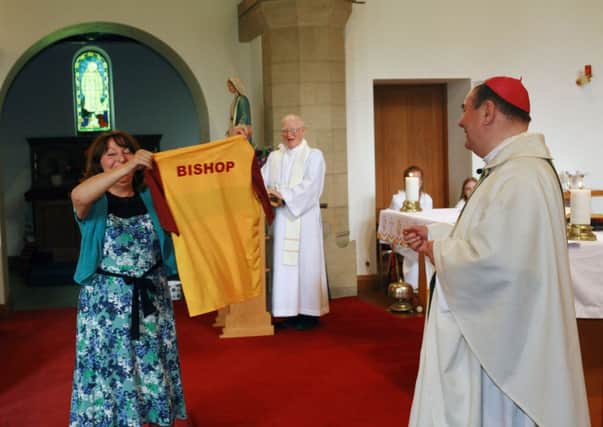 Bishop Joseph Toal got a surprise at his farewell mass in his home parish of Roy Bridge as a parishioner came forward and presented him with a Motherwell shirt with Bishop on the back.