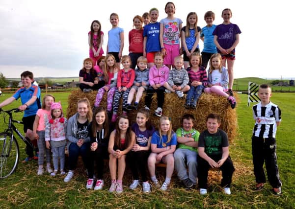 Hay there...youngsters gathered at Newbigging playing fields for races for all ages on Friday, May 30, 2014 (Pics by Rodger Price)