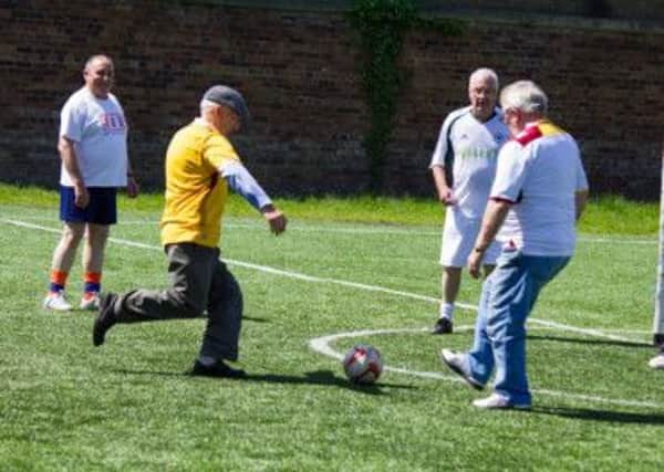 Although now in his 70s former Motherwell player Billy Reid is still keen to show off his skills.