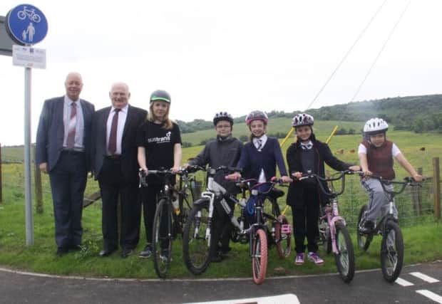 Council and transport officials with Cross Arthurlie kids Cameron, Emma Montgomery, Yusuf Amin and Maria McEwan