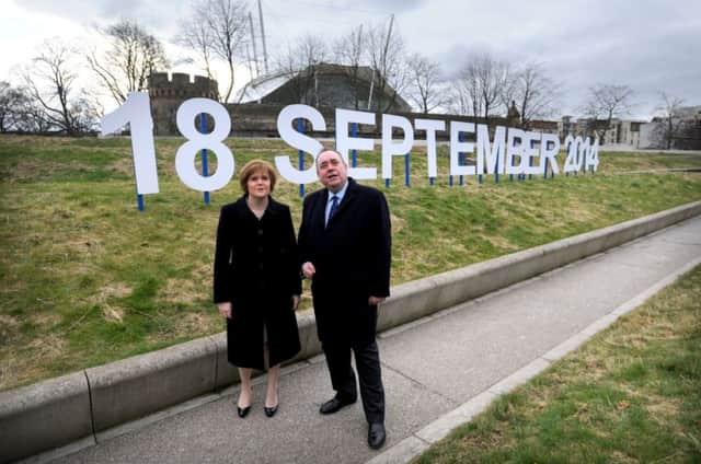 Picture by JANE BARLOW. 21st March 2013. The First Minister Alex Salmond announced to the Scottish Parliament in Edinburgh that the date of Scotlands referendum will be Thursday 18 September 2014. Pictured is the First Minister with Deputy First Minister Nicola Sturgeon.
