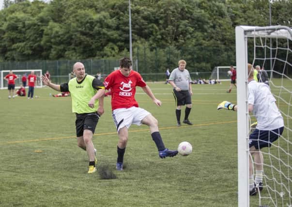 Action from the charity football festival.