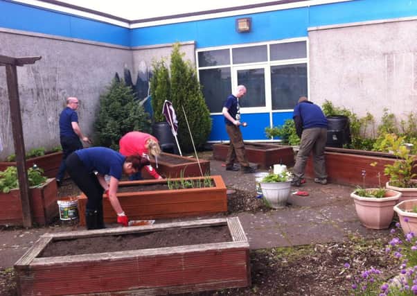 EDF staff hard at work at St Margaret of Scotland Primary School in Cumbernauld.