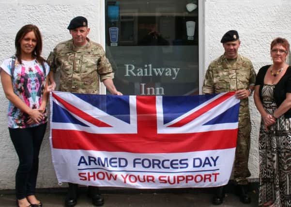 Reunion...for Carluke reservists Iain MacDonald and George Cairns at the Railway Inn. (Submitted picture)