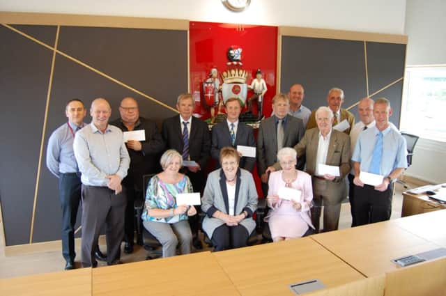 Business Awards charity beneficiaries receive their cheques