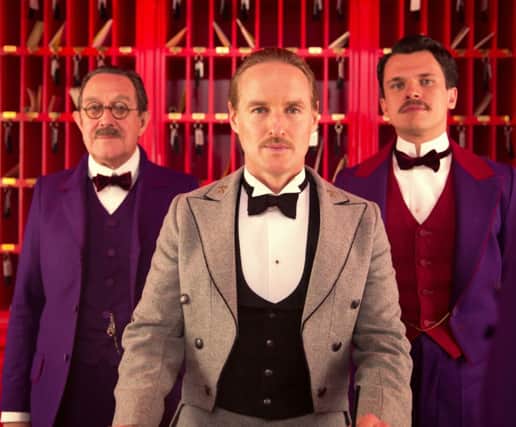 Owen Wilson as M. Chuck, Tom Wilkinson as Author and Florian Lukas as Pinky in The Grand Budapest Hotel.