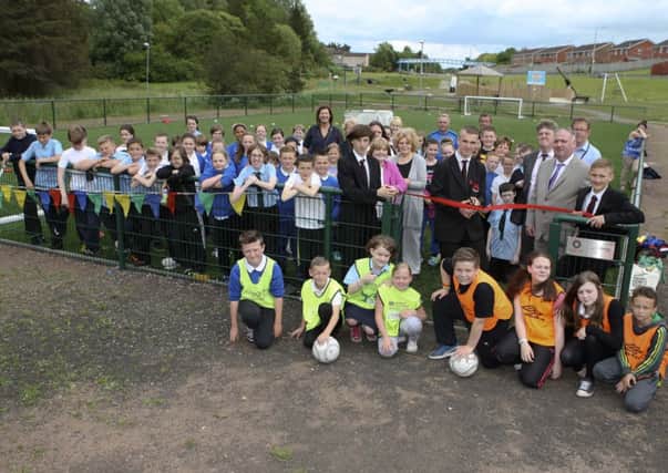Pupils from local schools with invited guests at the Broom Road ribbon-cutting ceremony.