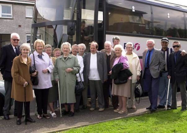 AWAY DAY: Members of Kilsyth Blind and Disabled Club are pictured at Charles Street, as they prepare to set off on a mystery tour in 2002. (Picture by Alan Murray, ref. 4544)