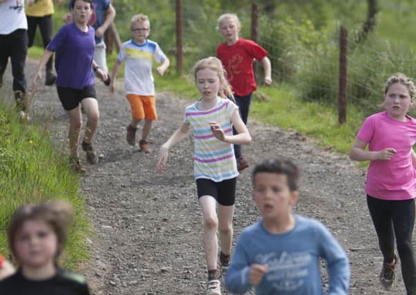 BANKNOCK, SCOTLAND - JUNE 7th: Pictured: Kids take part in the Mud n' Fun Run. Kids and adults completing obstacle course to raise cash for Strathcarron Hospice. (Photo by Jonathan Faulds)