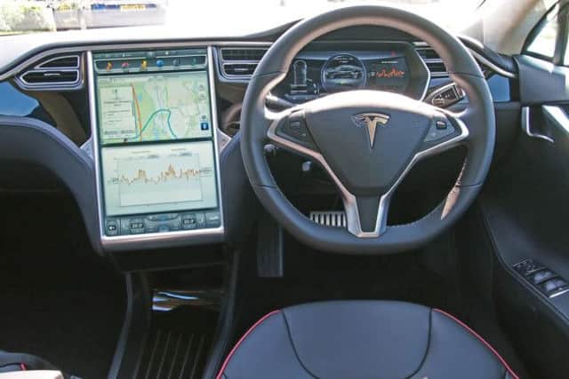 2014 Tesla Model S (electric car). The Tesla's interior is as eye-catching as the outside. See PA Feature MOTORING Road Test. Picture credit should read: PA Photo/Handout. WARNING: This picture must only be used to accompany PA Feature MOTORING Road Test.