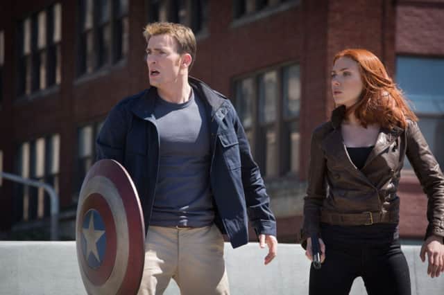 Captain America/Steve Rogers (Chris Evans) and Black Widow/Natasha Romanoff (Scarlett Johansson) in Marvel's Captain America: The Winter Soldier.