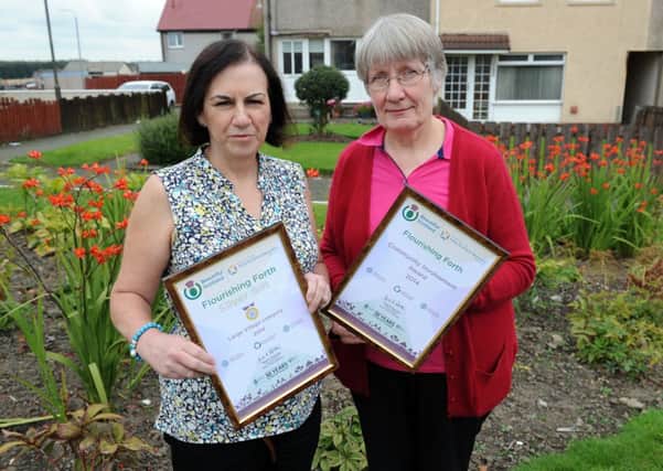 Flourishing...Agnes Gallacher and Ann Anderson with the awards Flourishing Forth won. (
Pic Alan Watson)