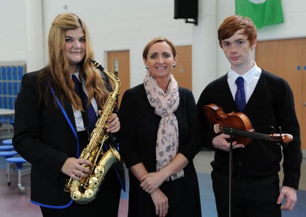 Starring role...Trust manager Kathleen Feeney with musicians Jennifer Park and Sean Allan (

Pics by Alan Watson)