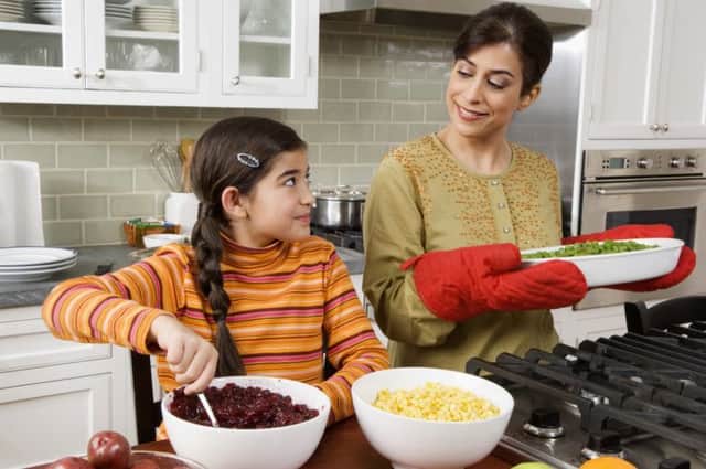 A Generic Photo of a mother and daughter cooking a meal in the kitchen. See PA Feature FAMILY Family Column. Picture credit should read: PA Photo/JupiterImages Corporation. WARNING: This picture must only be used to accompany PA Feature FAMILY Family Column.
