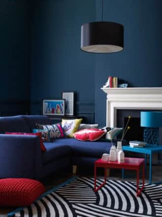 Jakob chaise corner sofa, in indigo blue, 1,000GBP; Helsinki nest of tables, 161GBP, from the Ben de Lisi range, Debenhams.