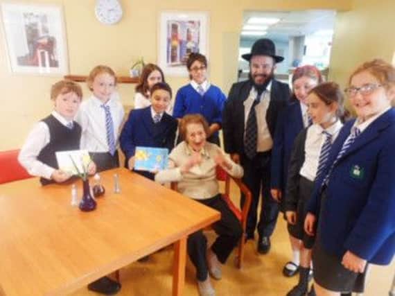 Westacres resident Ms  Aronson welcomes Calderwood Lodge pupils and Rabbi Mendel Jacobs
