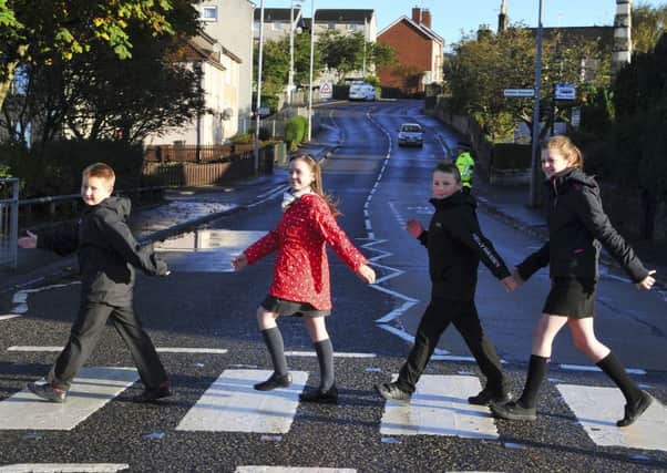 WALKABOUT: Youngsters from Kilsyth Primary and St Patrick's Primary take part in Walk to School Month.