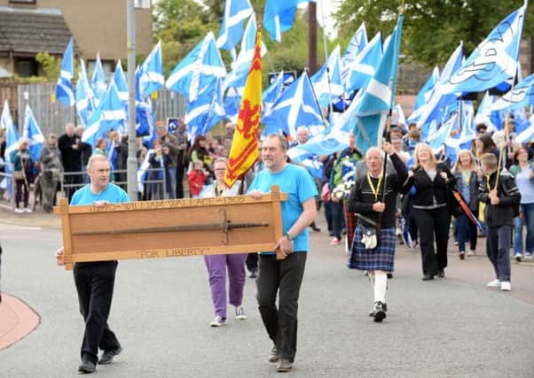 Marching...in memory of William Wallace in Lanark High Street, this year's Wallace Day parade was also used to deliver the Yes message (Pics Alan Watson)