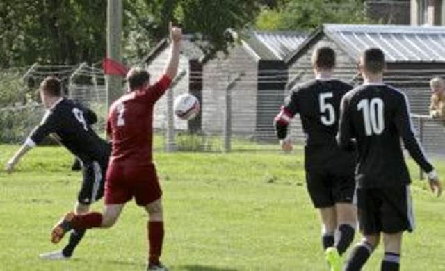 Davie Winter produces a back heel volley into the Bole's net. Pictures by Ross MacDonald.