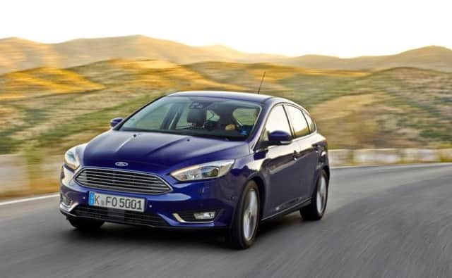 2014 Ford Focus five-door hatchback (5-door). The new Focus has adopted the more prominent front grille from the Fiesta.