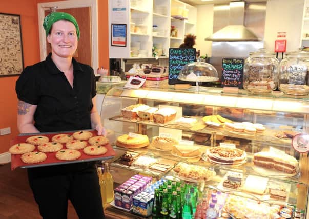 Mouth-watering...Kym Fletcher with some of her baking in the Wallace Tea Rooms, voted Scotland's best.
