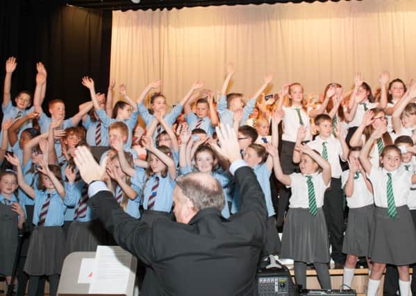 All together now...all of the schools joined forces for a number which was well worth waving your hands along to! (Pics by Sarah Peters)